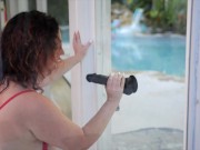 Preview 1 of MILF Rides Black Dildo on Window for Pool Boy