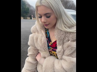 A Nice Blondie in Colorfull Dress is Smoking and Spitting