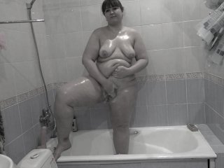 Mature depraved BBW MILF with hairy cunt fucks with a dildo in the bathroom.