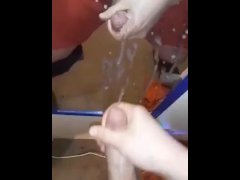 Young stud spraying mirror with cum.