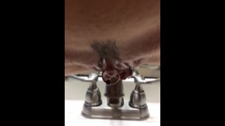 swinginmilf uses a sink to drain her sweet pussy of piss
