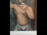 Young muscular bull cums while flexing in the mirror