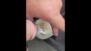 Pissing in bottle in parking lot wit strangers walking by and windows down