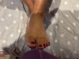 Stroking a bulge with my painted toes and feet, short vid.