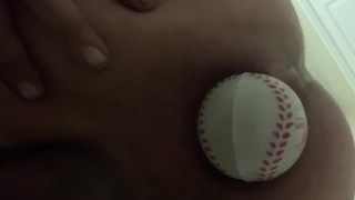 Baseball in ass
