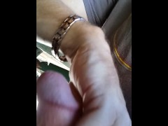 Hot guy hanging out at the park.  Playing with his big dick at a public picnic table