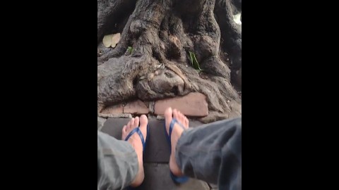 Flip flops dude on the streets wiggling his foot