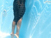 Preview 3 of A woman floats in a butterfly-adorned mesh dress