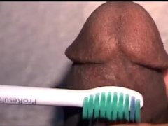 Sperm hole close up with the electric toothbrush