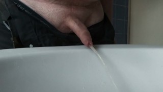 Boy Peeing with closed Foreskin
