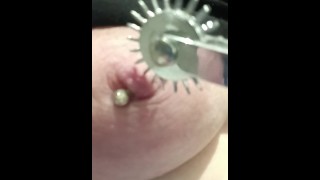 Painful nipple torture needle pricking pinwheel on pierced tits