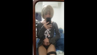 A femboy masturbating in front of the mirror