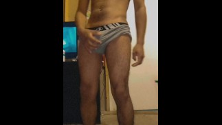 Skinny brunette Mexican in boxers in front of the camera