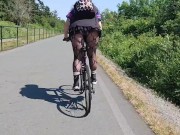 Preview 2 of Following woman in mini skirt and fishnets biking