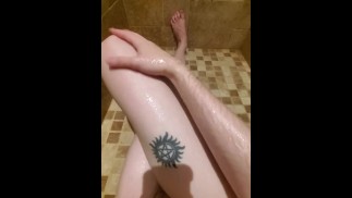Thumbnail Freshly shaved legs and pussy glisten in the shower