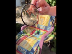 A blondie girl is coughing and hocking a really big loogie spitting it out and showing it