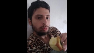Just a boy eating an apple