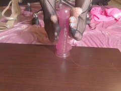 Cute feet in fishnets stroking pink dildo