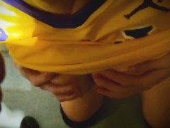 Basketball player gives coach a blowjob in the bathroom at the back of the gym.