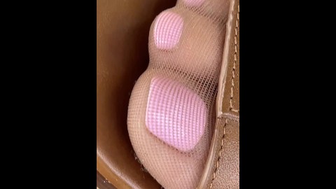 Closeup of wife's crazy cute pantyhose feet and pink toes