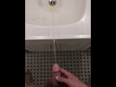 Man Pissing in the Sink