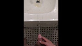 Man Pissing in the Sink