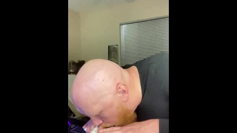 Bald ginger sucking dildo