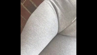 A Desperate Public Urinal Wearing Tight Grey Pants Stuck In An Alleyway