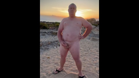 Naked on the beach wanking and cuming on the rock