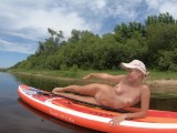 Naked gymnastics on the sup board