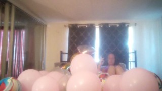 Milf with extreme long hair popping balloons and smoking cigarettes while filming up her own skirt