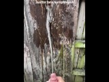 Boner peeing while jerking off on a fence outside