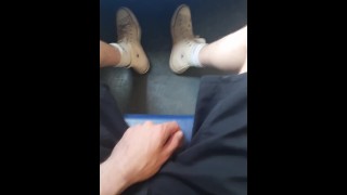 Yong skater show off his sneakers in the train