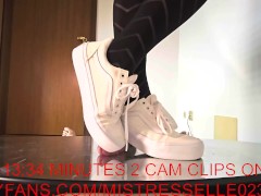 Mistress Elle flattens her slave's cock with her vans