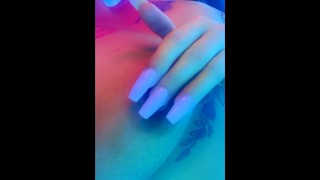 Rubbing on my hard pierced nipples in the tanning bed