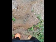 Preview 2 of Girl pissing in a puddle in the pouring rain on the side of the road