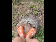 Preview 2 of Pervert girl pissing in the woods from a tree stump