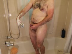 Man soak soap and wash his body especially groin area and penis thoroughly