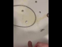 pissing into the bathtub