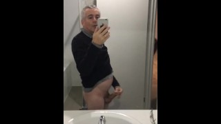 Stroking my erect penis until I climax and ejaculate