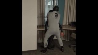 guy in wetsuit humps dummy at hotel window