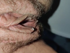 Barefoot girl peeing standing in the public toilet