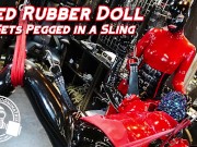 Preview 1 of Red Rubber Doll Gets Pegged in Sling - Lady Bellatrix in latex catsuit with strapon