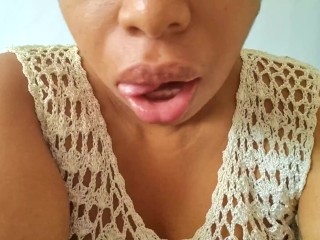 Ebony Girl Sucks her Fingers Suggestively and tries to make you Horny with her Wet Mouth