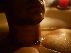 Chest close-up in the bathroom by candlelight