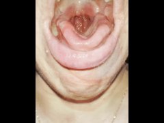 A blondie teen has a really bad cough shes coughing and spitting with mouth and throat open close up