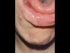 A blondie teen has a really bad cough shes coughing and spitting with mouth and throat open close up