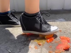 Crushing a small tomato and orange