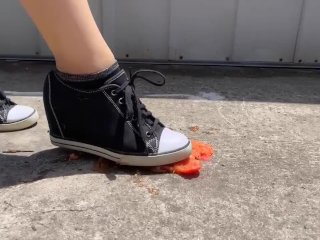 Crushing a small tomato and orange