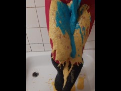 Thick coloured slime on pink pantyhose